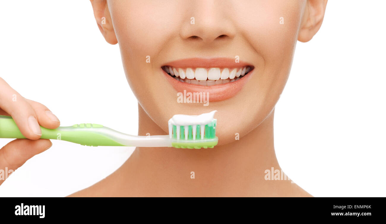 Donna con spazzolino da denti Foto Stock