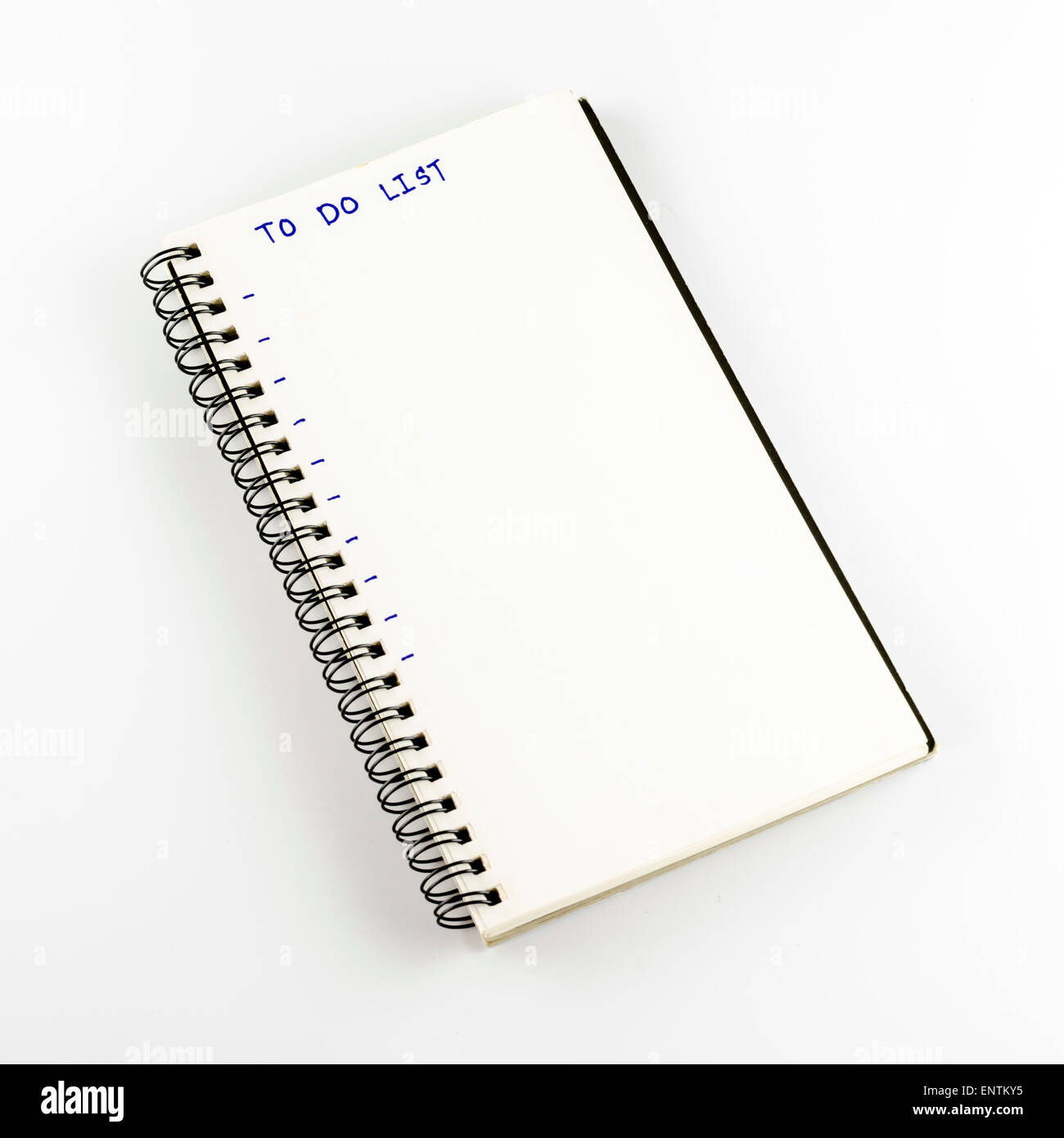Notebook scrivere Lista da fare parola su un bianco di massa posteriore Foto Stock