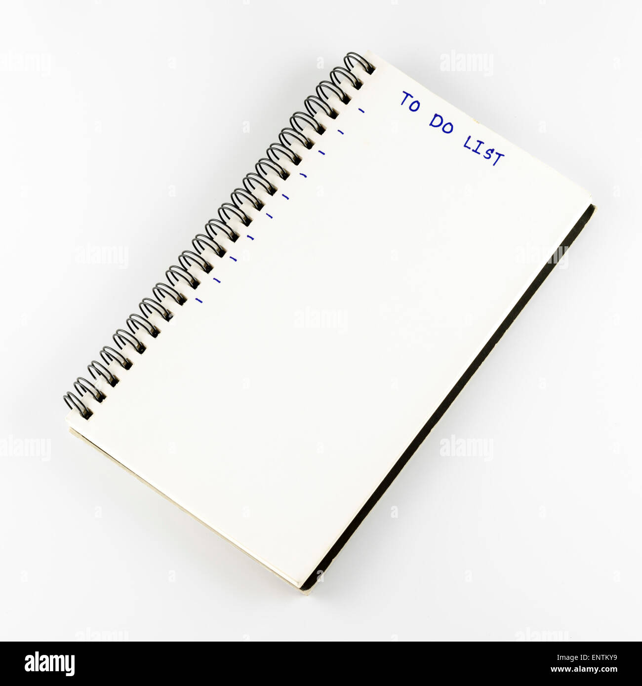 Notebook scrivere Lista da fare parola su un bianco di massa posteriore Foto Stock