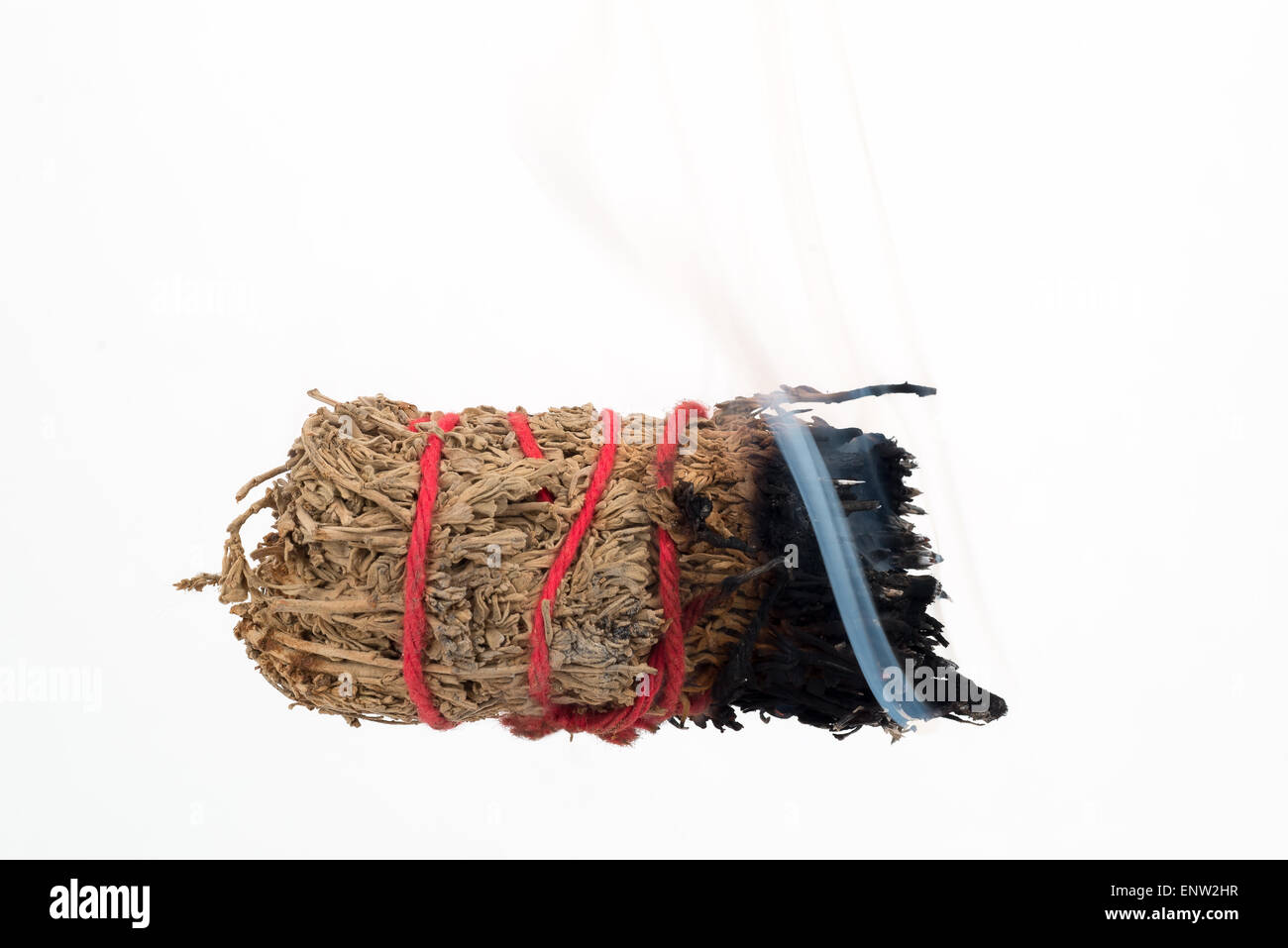 La masterizzazione di imbrattare di bastone usato per la purificazione. Foto Stock