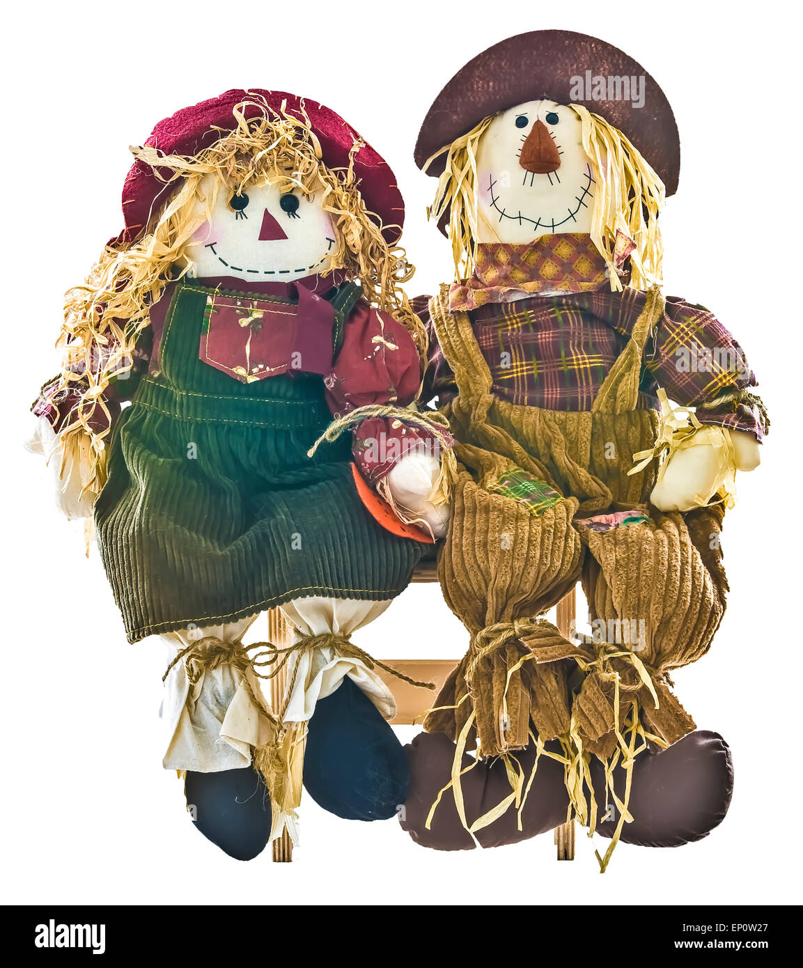 Decor caduta lo spaventapasseri un ragazzo e una ragazza seduta sul banco di legno. Foto Stock