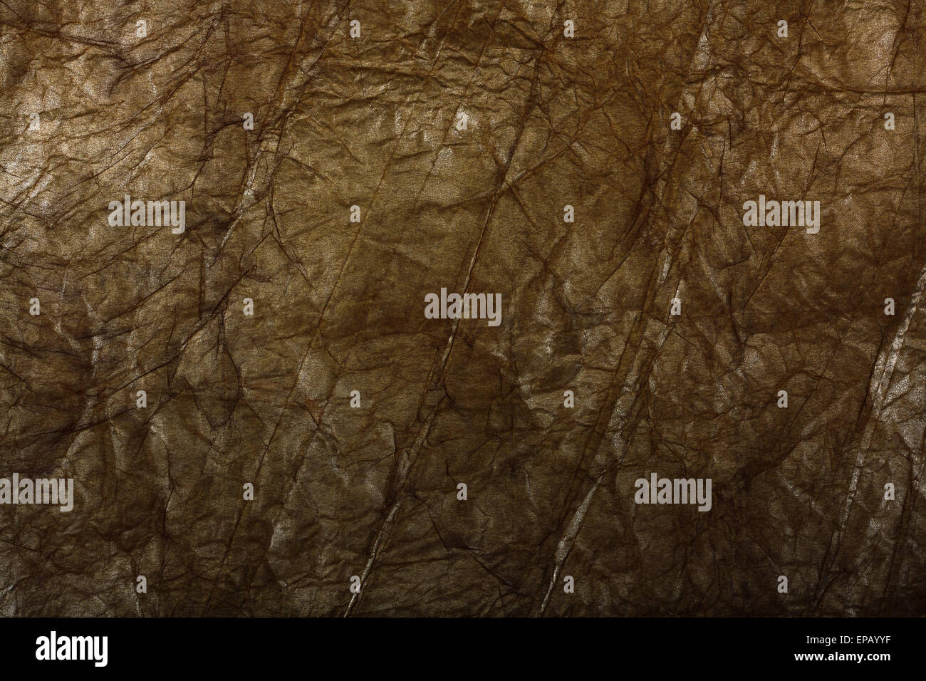 Golden crumpled carta di avvolgimento. Sfondo astratti per la progettazione Foto Stock