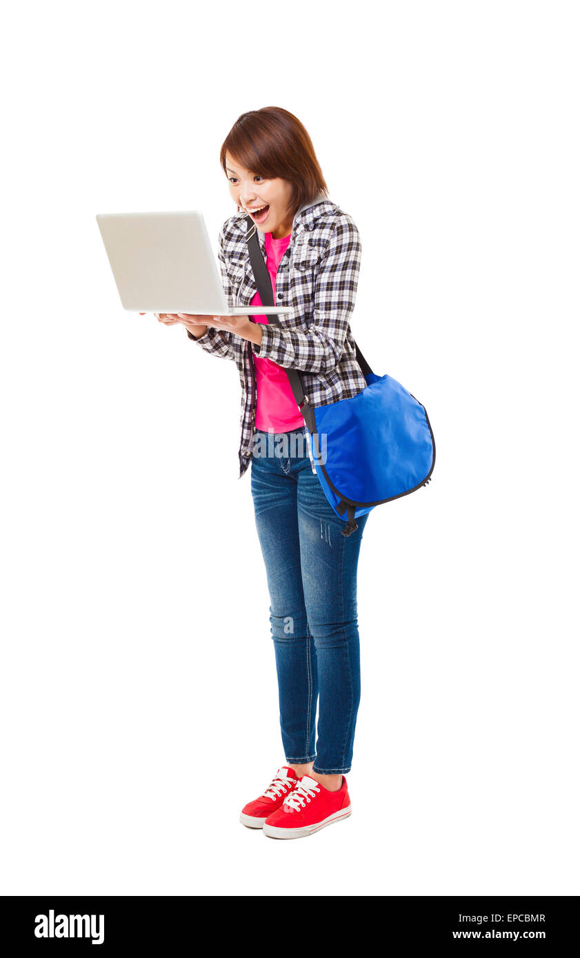 Sorpreso giovane studente felice con il computer portatile Foto Stock