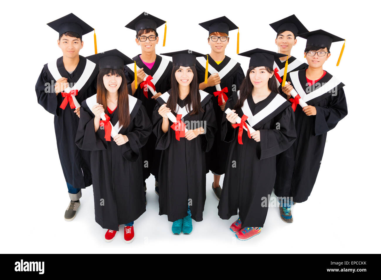 Un gruppo di studenti asiatici che celebra la graduazione Foto Stock