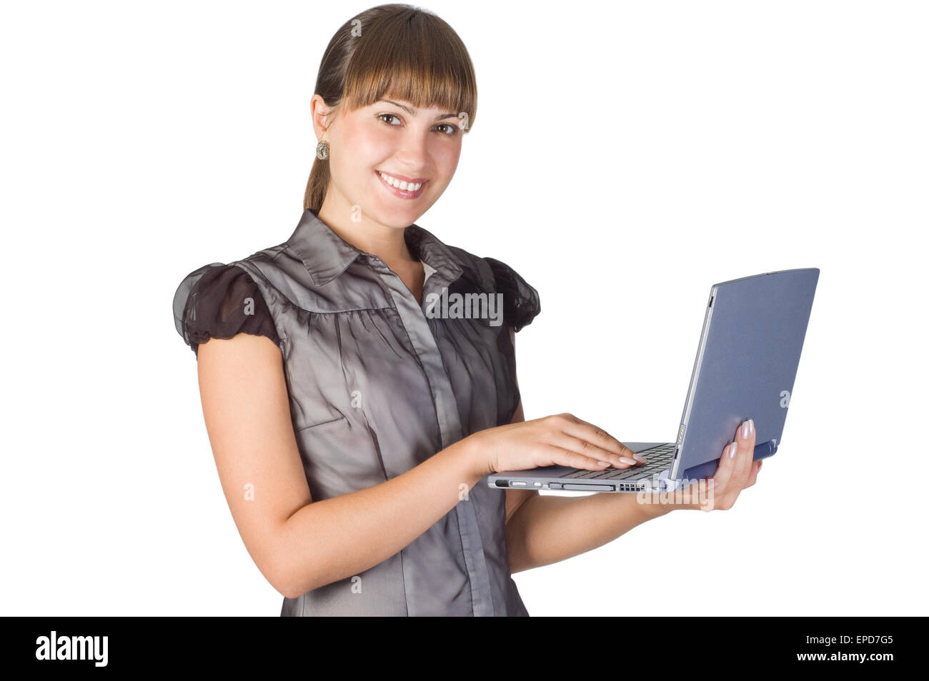 Immagine del giovane bella ragazza con il computer portatile isolato su bianco Foto Stock