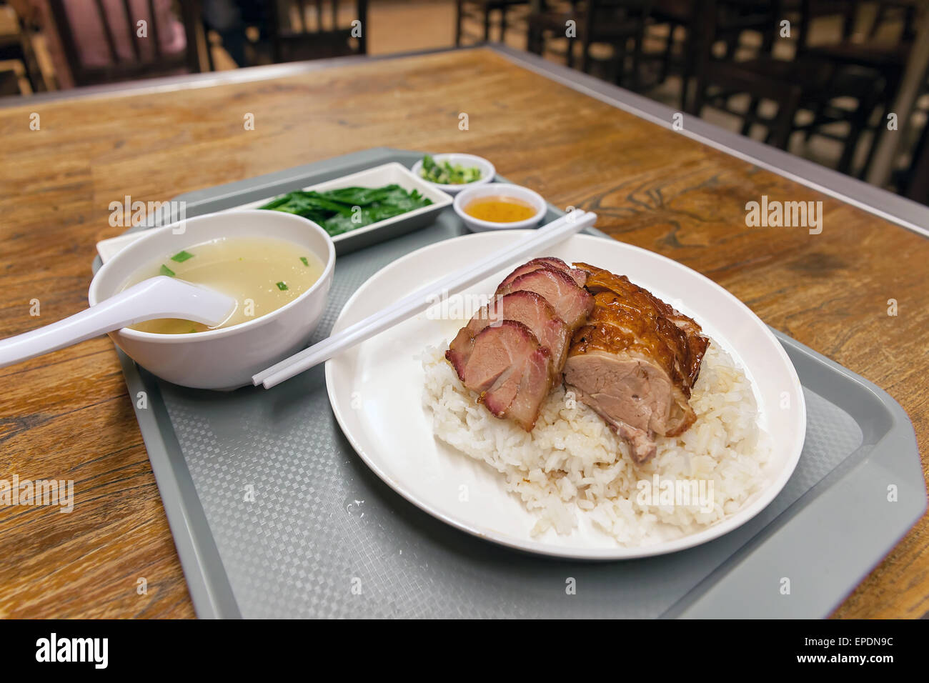 Anatra arrosto e carne di maiale barbecue su piatto di riso a Hong Kong Ristorante Foto Stock