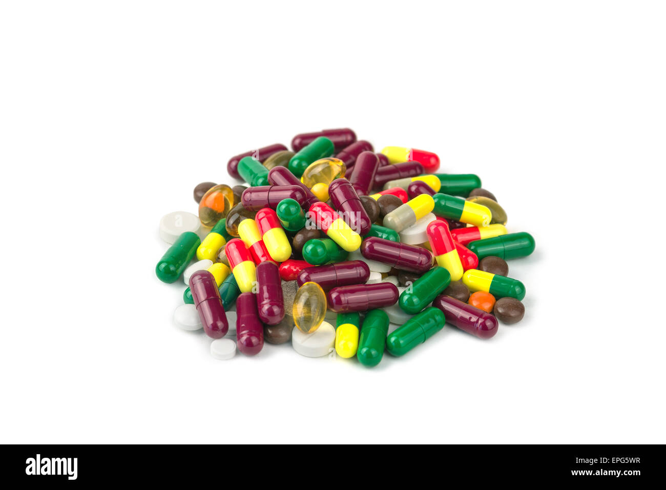 Pillole di colore isolato su bianco Foto Stock