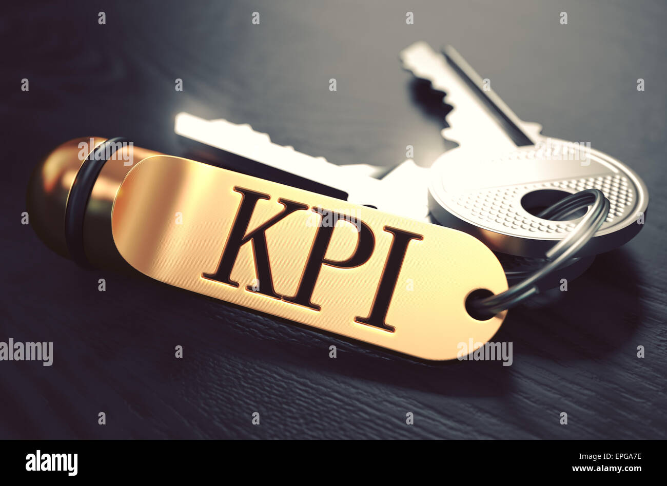 I KPI - Indicatore chiave Index - mazzo di chiavi con il testo su Golden portachiavi. Nero lo sfondo di legno. Primo piano con Fo selettiva Foto Stock