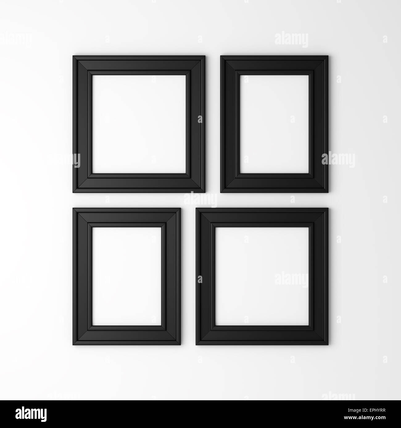 Quattro nera vuota cornici foto sul muro bianco Foto Stock