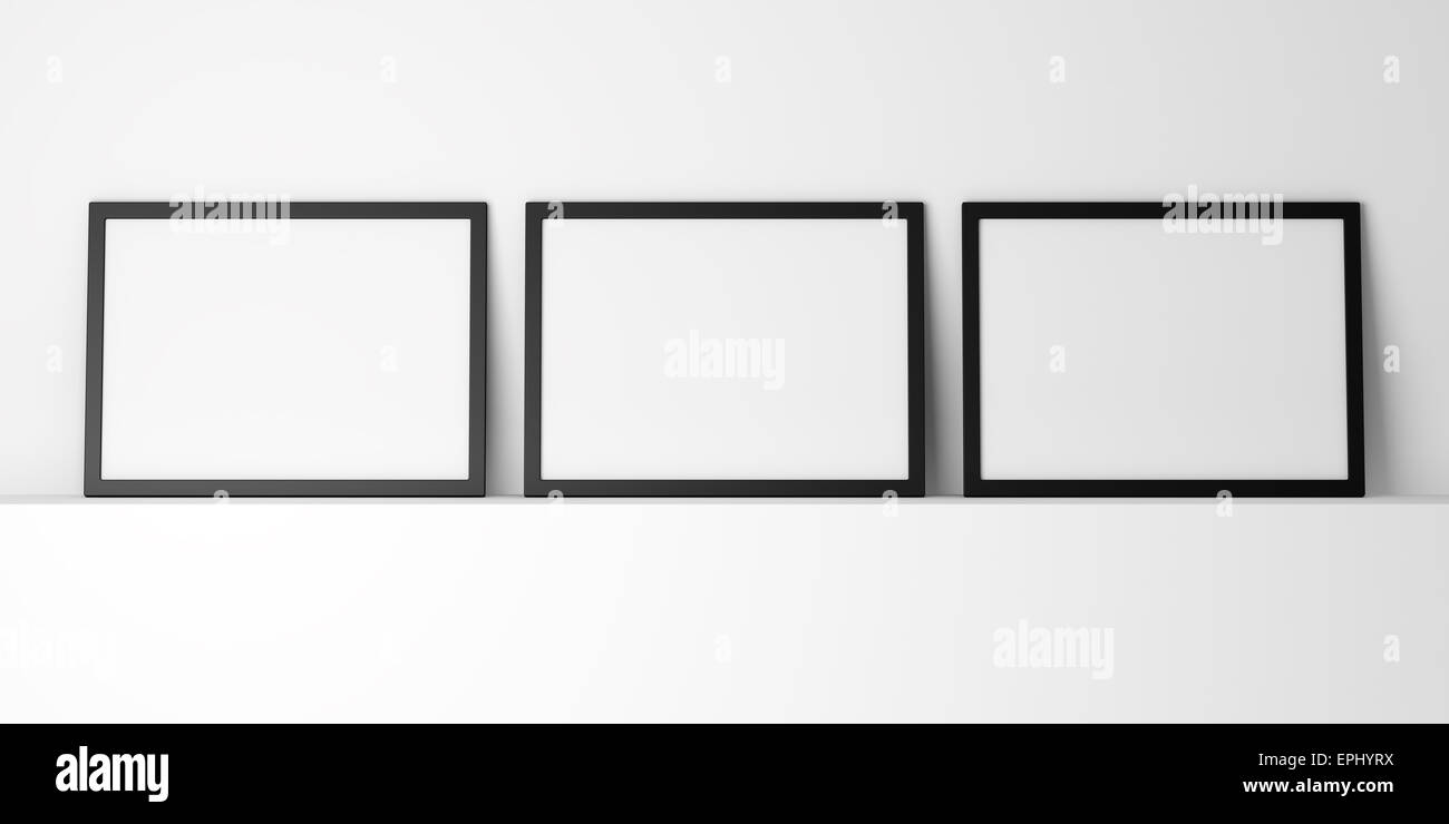 Tre nero vuota photo frame sullo scaffale bianco Foto Stock