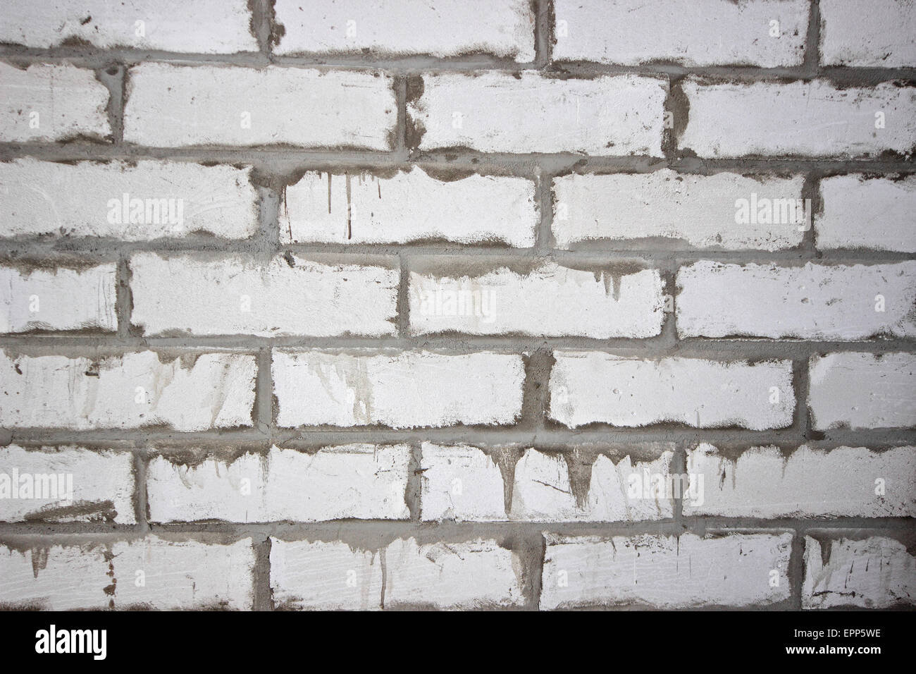 La tessitura di un bianco sporco e parete di mattoni Foto Stock