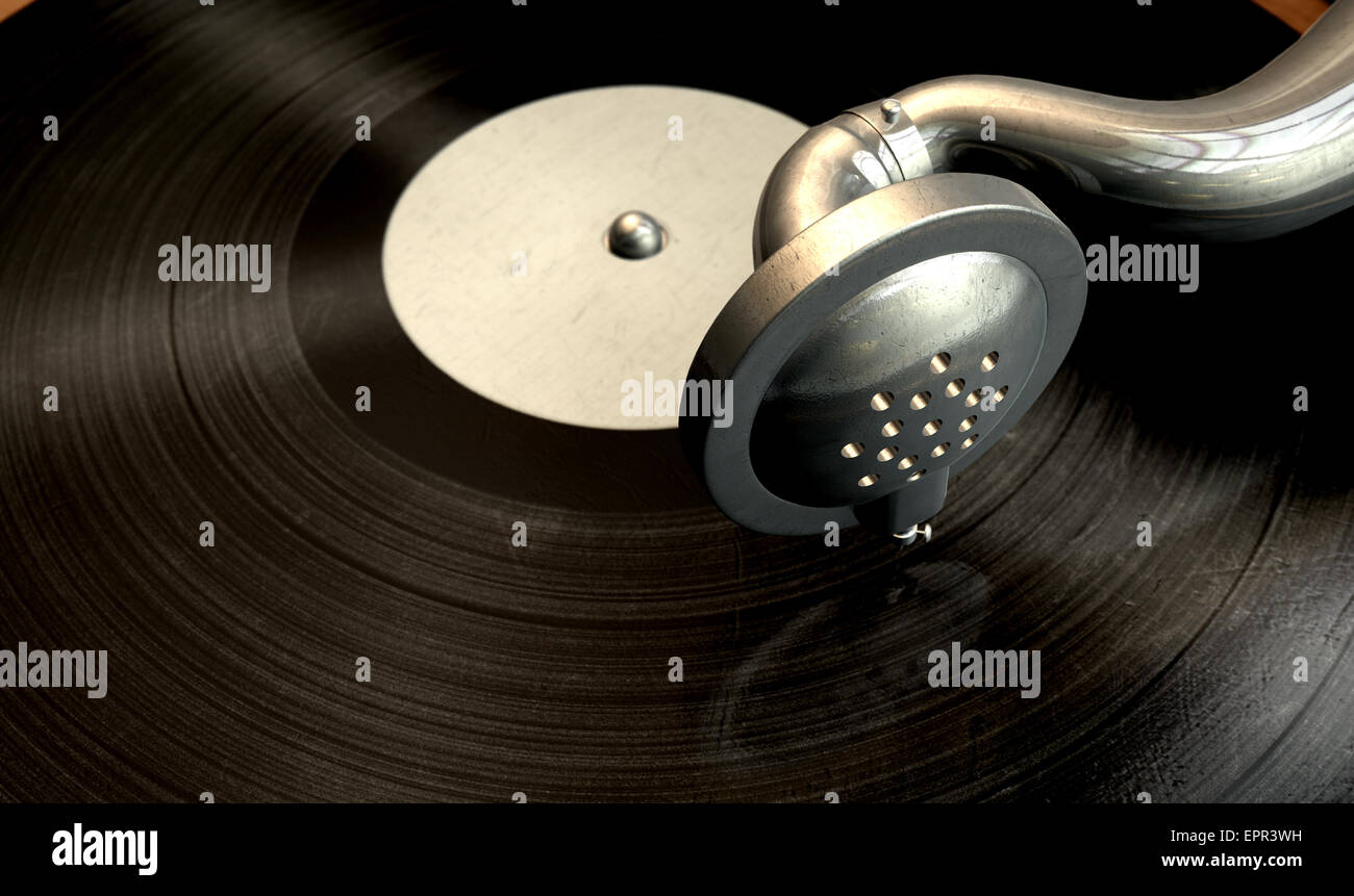 Un primo piano og l'ago di un vecchio ottone e legno grammofono toccando un vinile isolato su un sfondo scuro Foto Stock