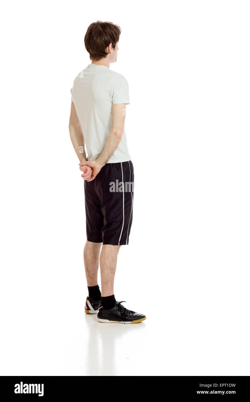 Modello isolato su sfondo semplice in studio da dietro Foto Stock