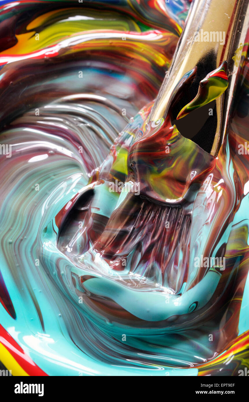 Close-up di vernice volute e spazzola Foto Stock