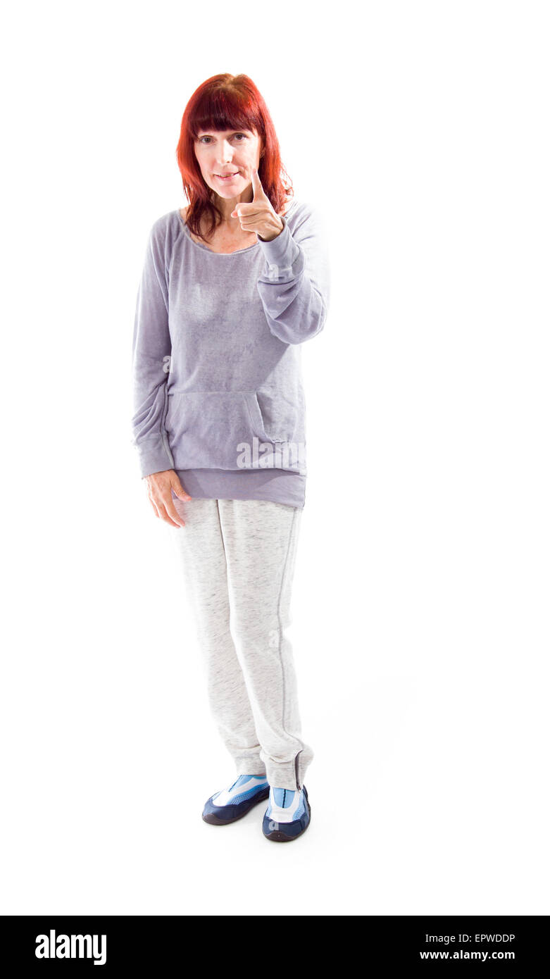 Donna matura rivolta verso la telecamera Foto Stock