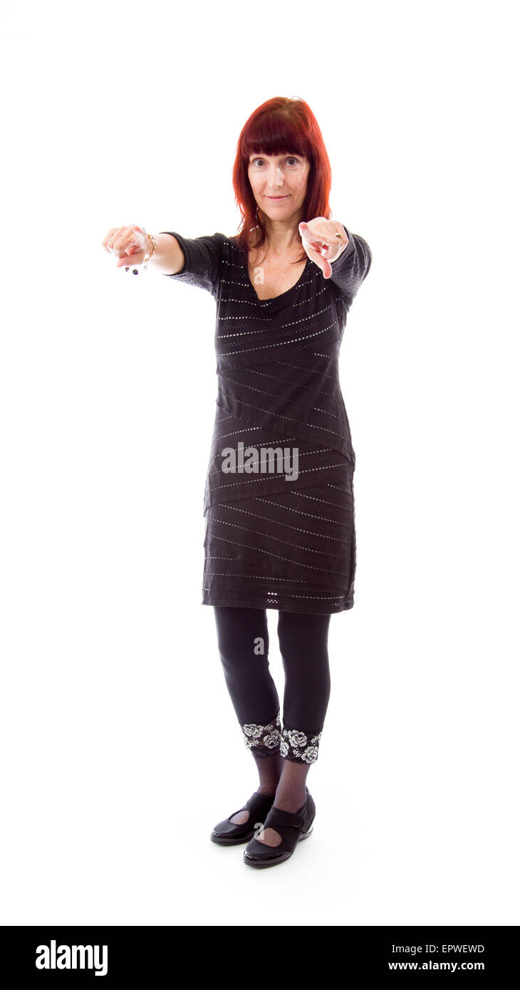 Donna matura rivolta verso la telecamera da entrambe le mani Foto Stock