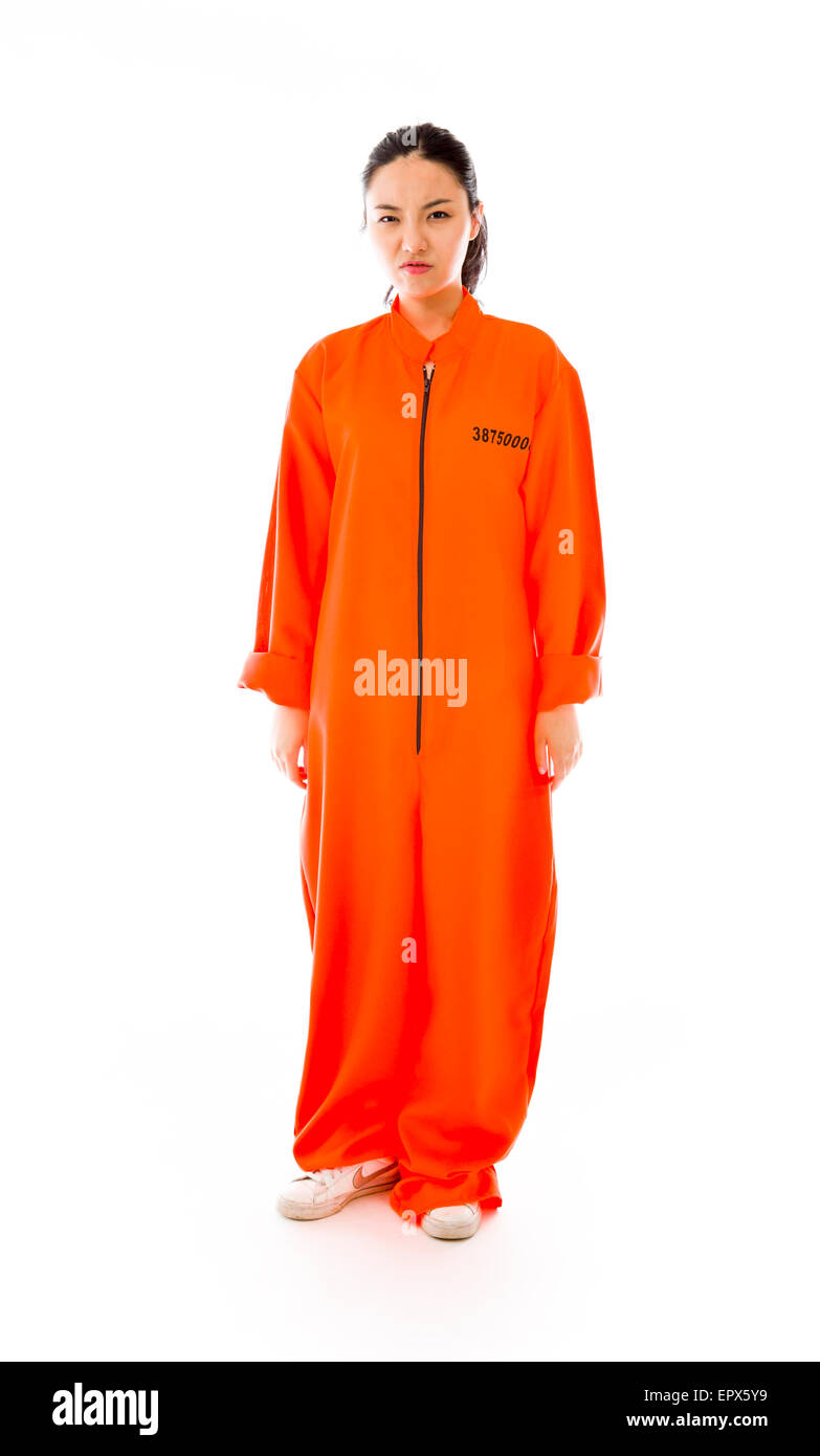 Sconvolto giovane donna asiatica in uniforme dei prigionieri Foto Stock Sconvolto giovane donna asiatica in uniforme dei prigionieri Foto Stock