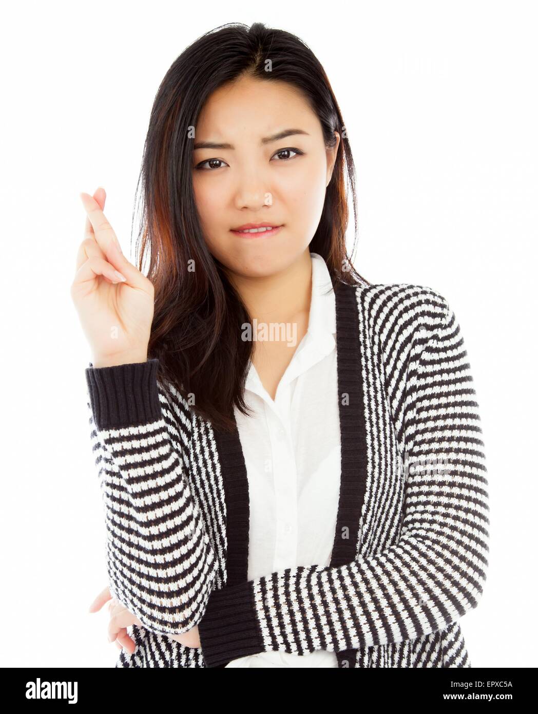 Attraente ragazza asiatica nel suo ventenne isolato su un sfondo plein girato in uno studio Foto Stock