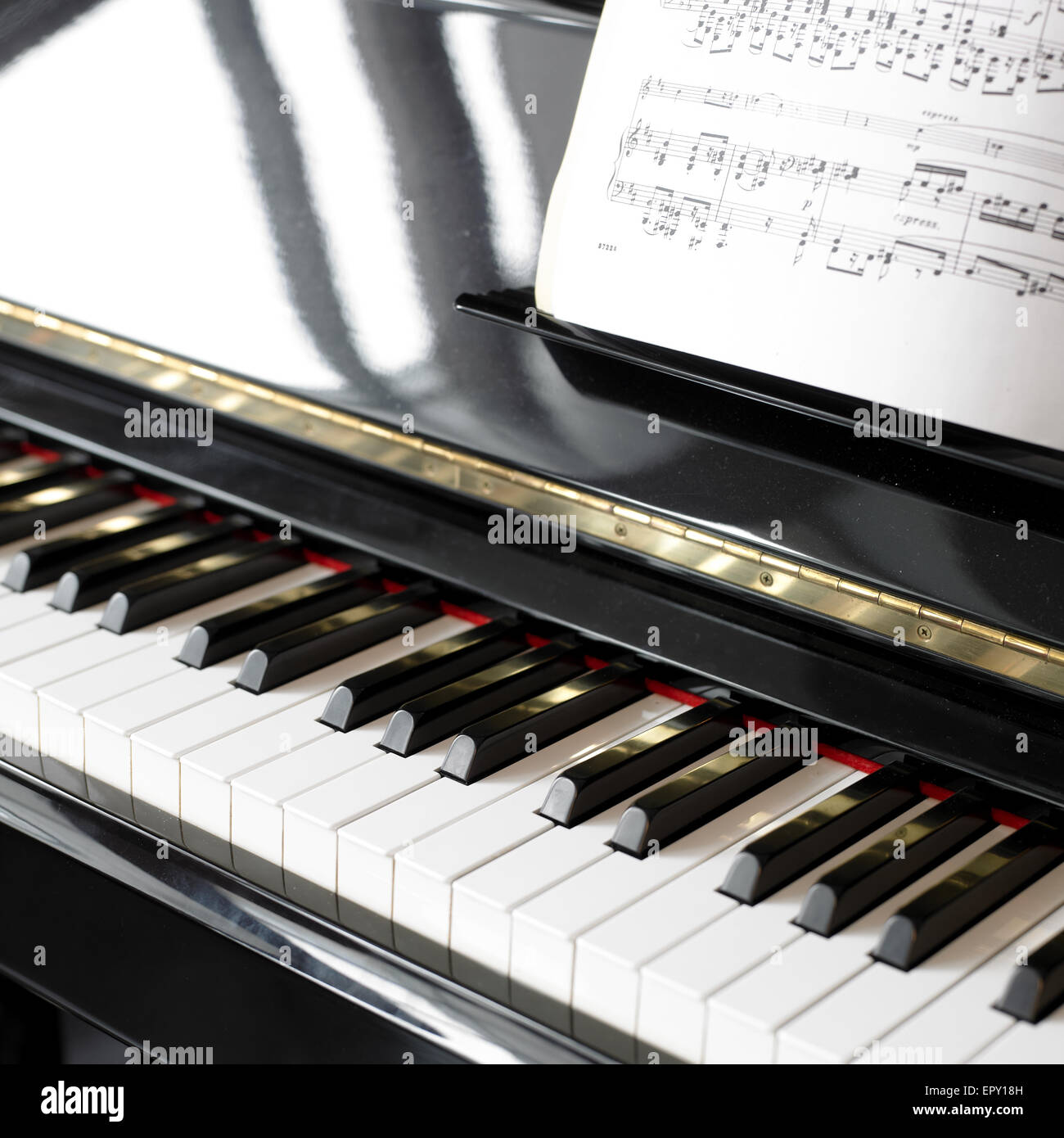 Close-up di una nota musicale di libri e un pianoforte Foto Stock