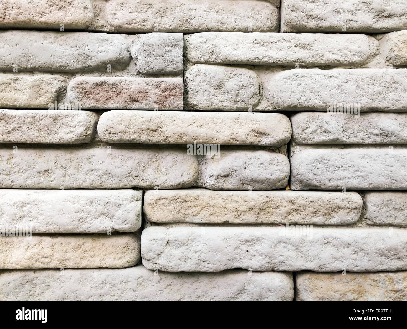 In mattoni di pietra arenaria parete del bagno esterno. Foto Stock