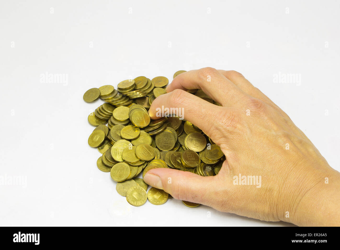 Donna mano prendendo un sacco di monete Foto Stock
