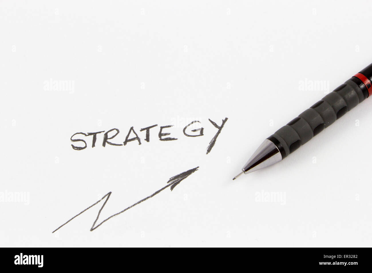 Idea di strategia tracciata con una matita su carta bianca Foto Stock