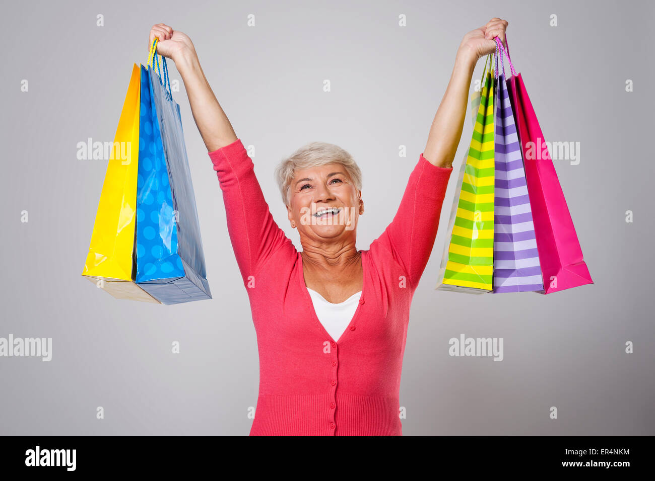 Vecchia Signora ama lo shopping Foto Stock