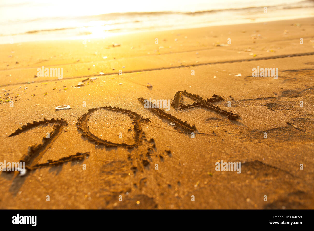 Anno Nuovo 2014 numero sulla sabbia Foto Stock