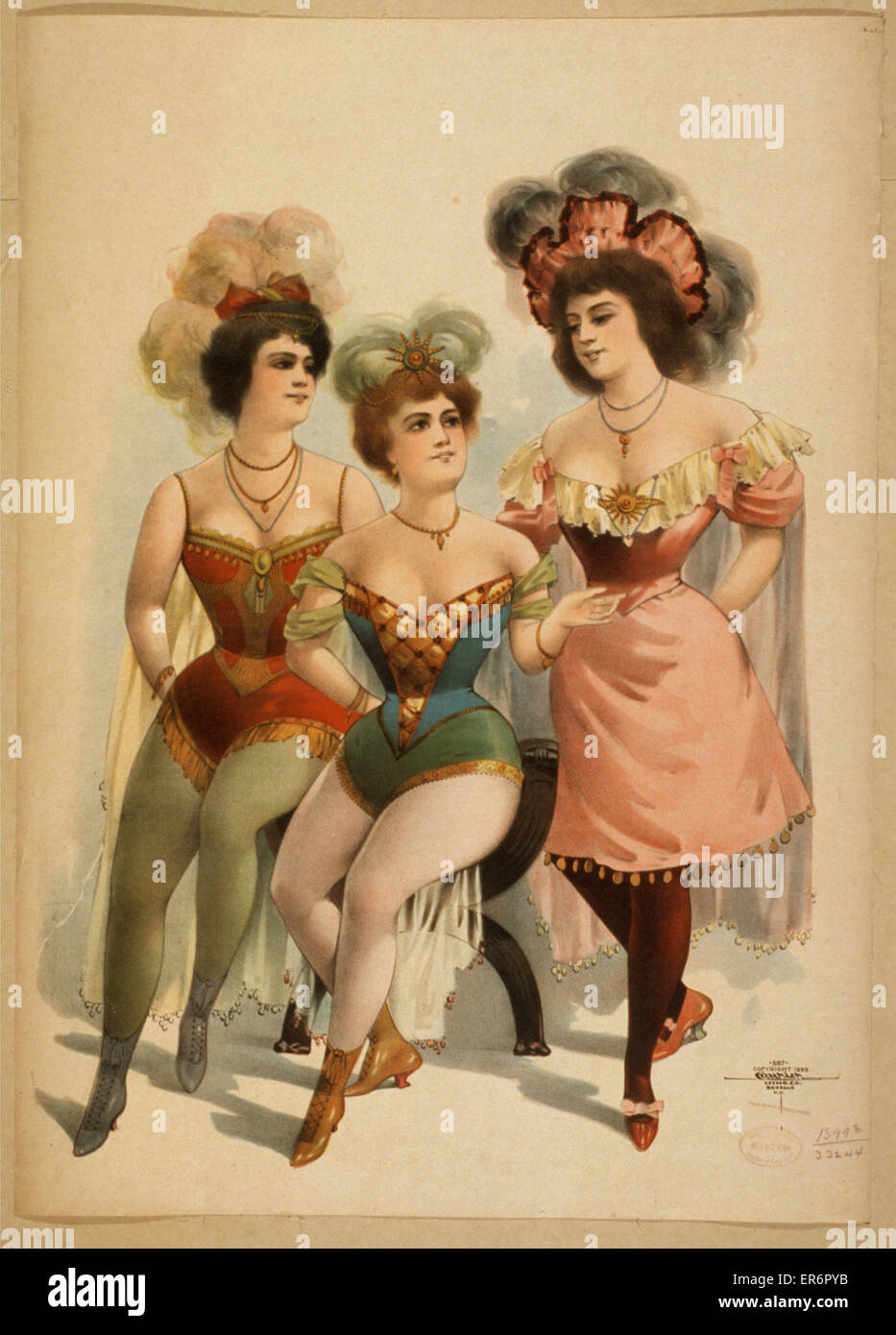 Tre donne in collant e piume Foto Stock