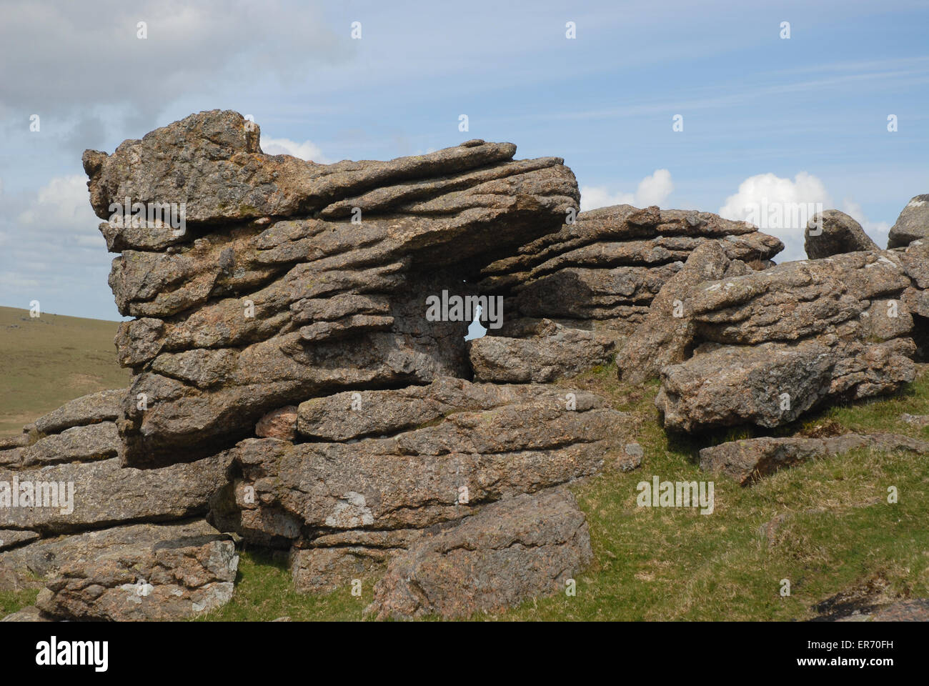 Granito spiovente sperone di roccia, punto centrale Tor, Parco Nazionale di Dartmoor, Devon, Inghilterra Foto Stock