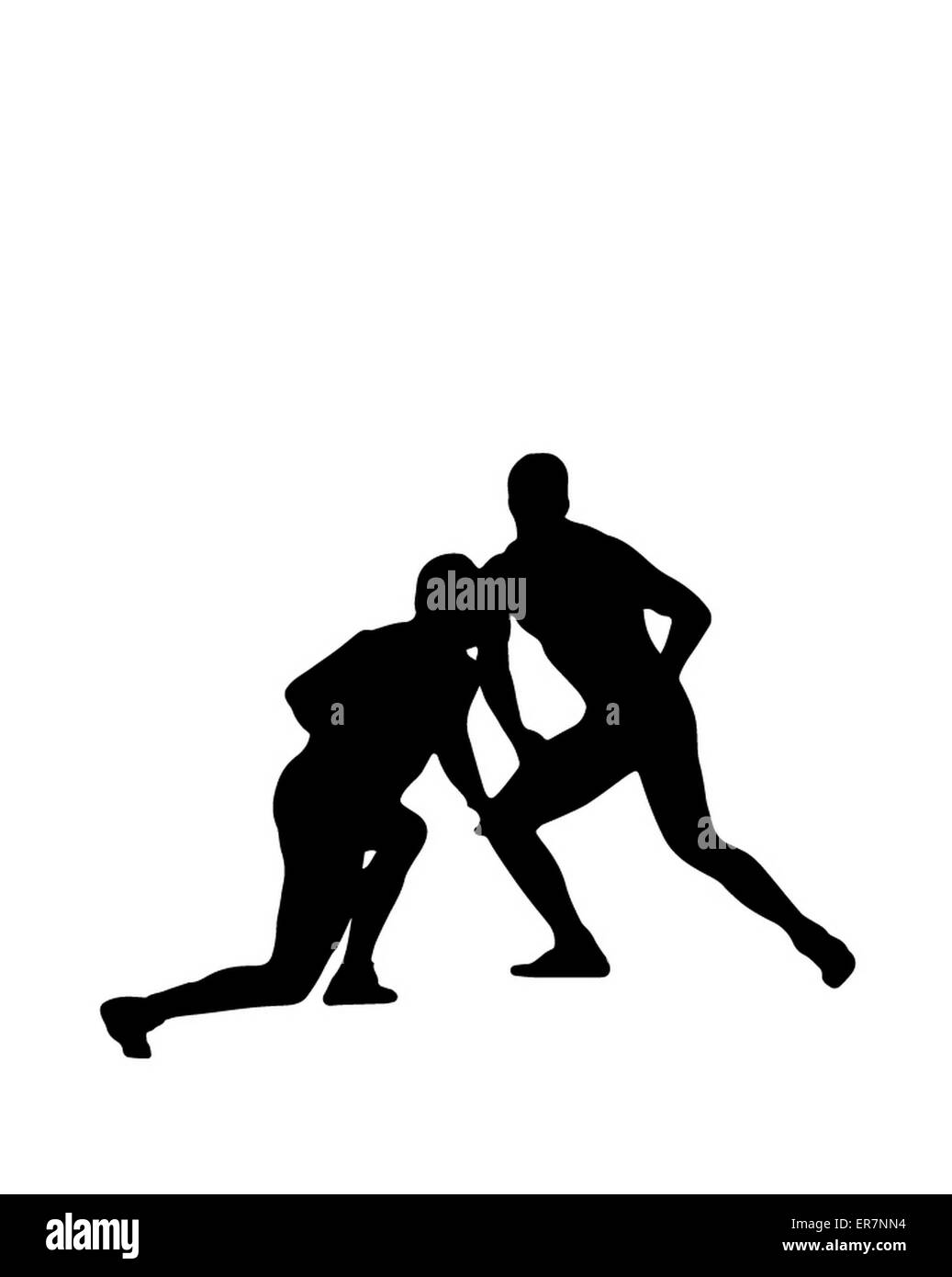 Silhouette di due lottatori nella lotta sul tappeto. Foto Stock