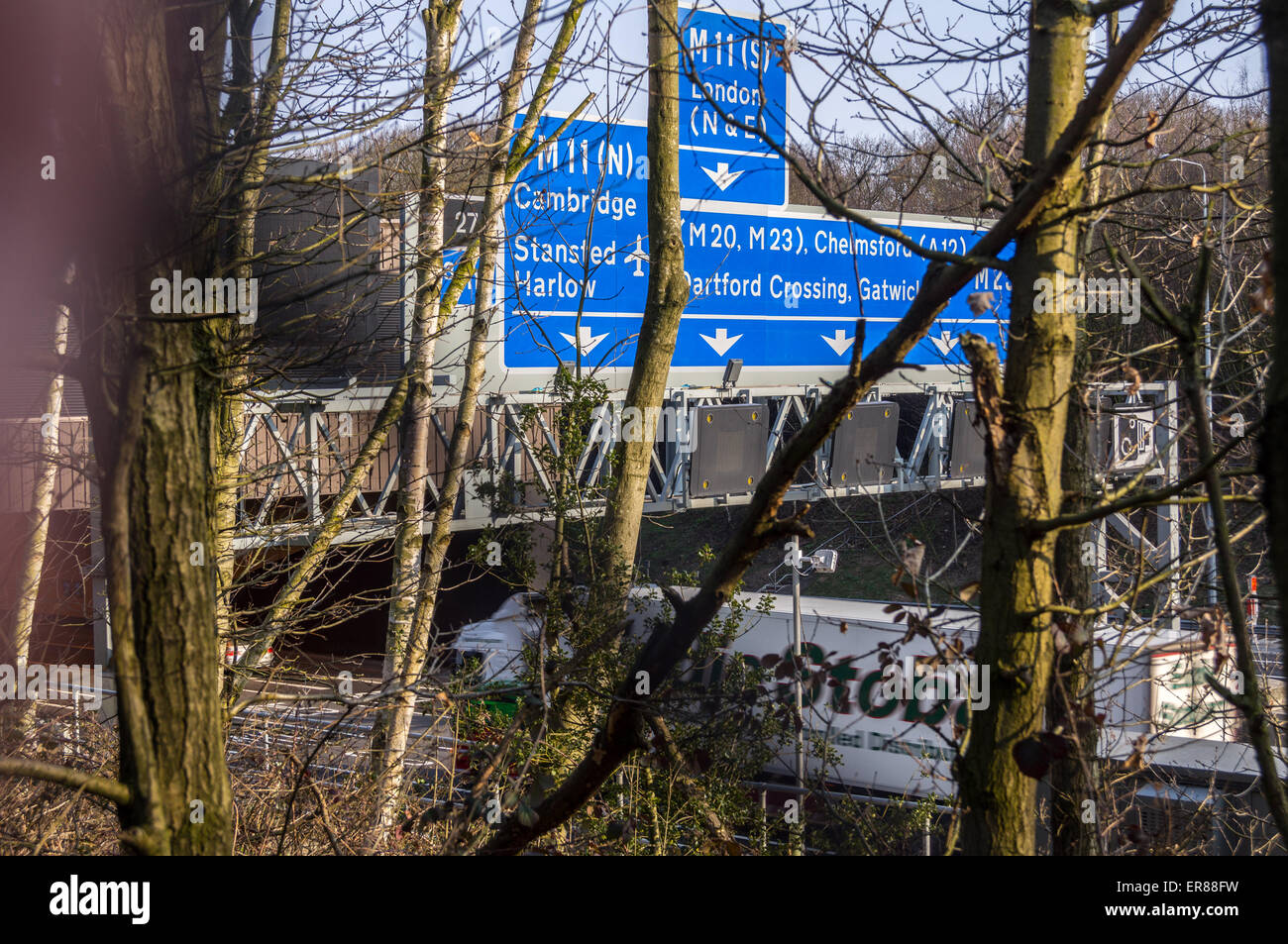 Indicazioni all'entrata a campana Tunnel comune sulla M25 autostrada, Epping, Essex, Inghilterra Foto Stock