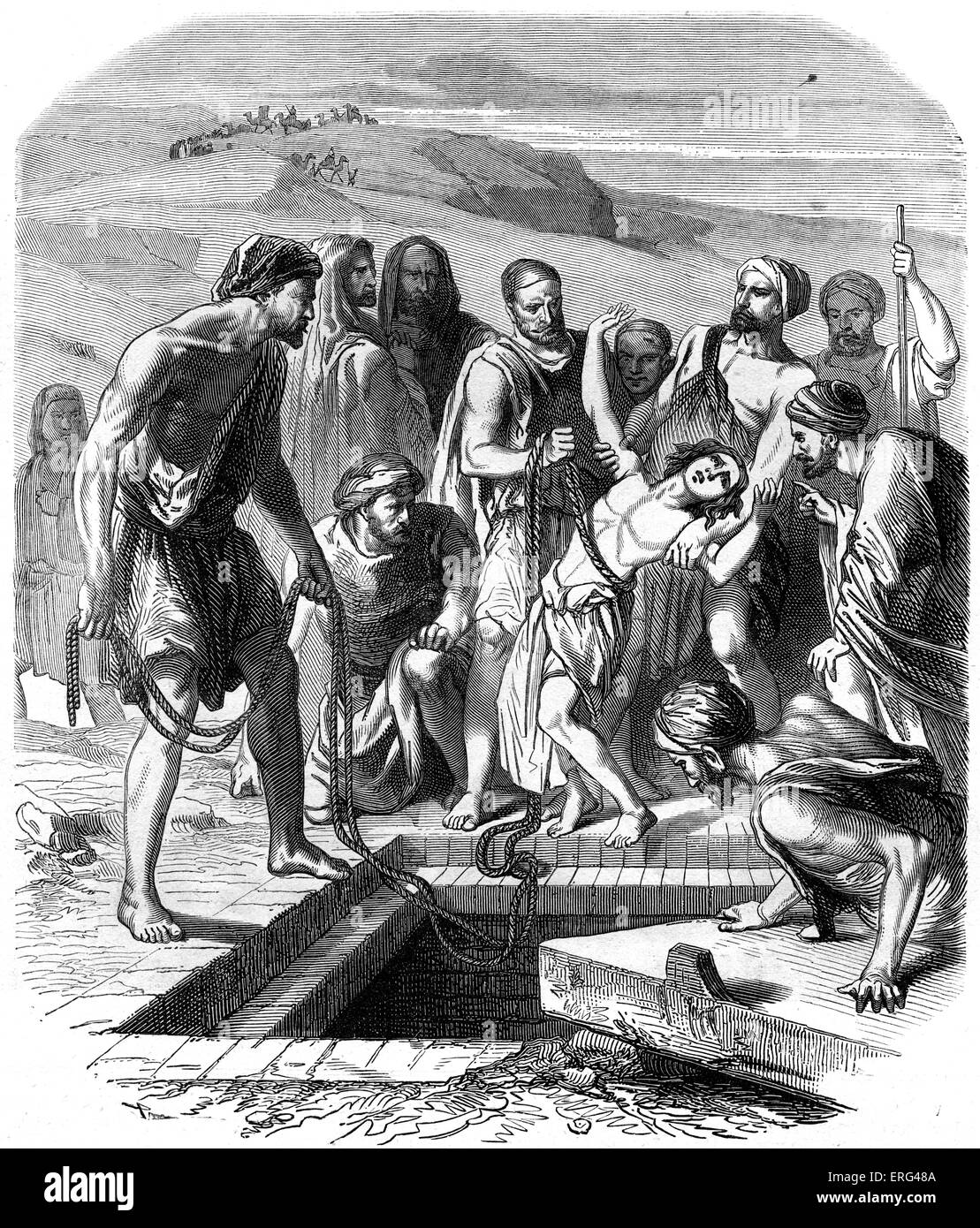 Joseph 's fratelli buttare a lui nella fossa. Genesi, Capitolo XXXVII. Foto Stock