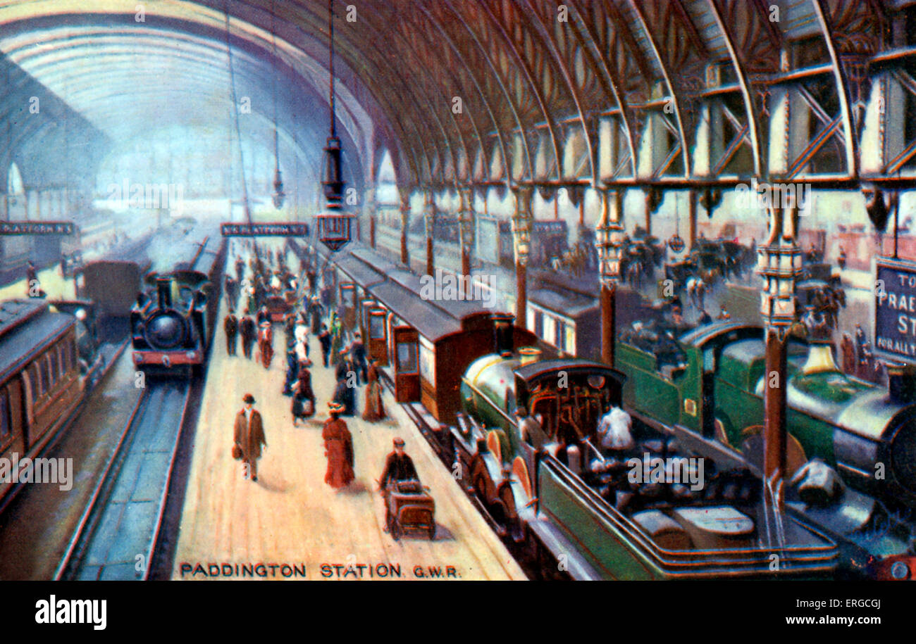 Paddington Street Station GWR. I passeggeri di salire a bordo del treno, pompiere preparazione del carbone per il motore di vapore. Foto Stock