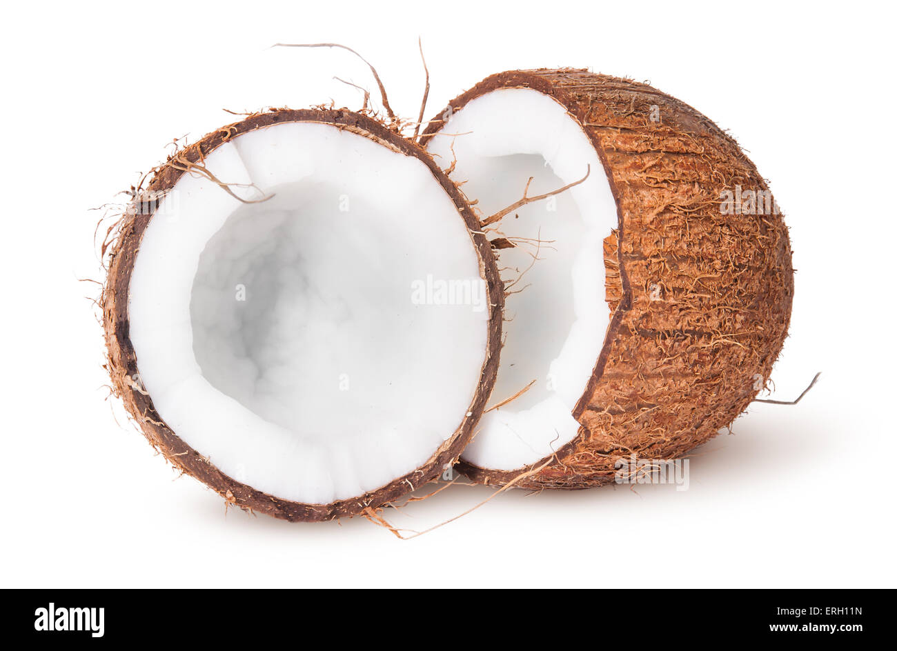 Due metà di noce di cocco isolati su sfondo bianco Foto Stock