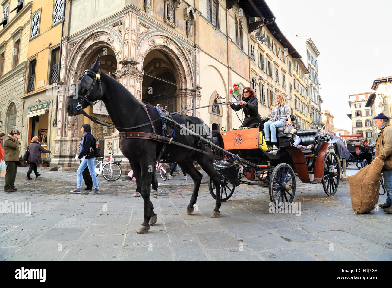 Carrozza a cavalli in Piazza San Giovanni, Firenze Foto Stock