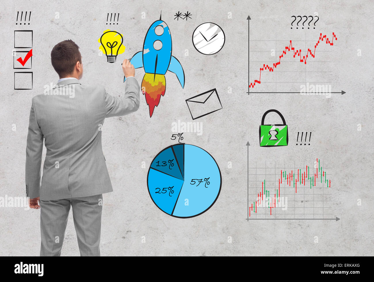 Imprenditore rivolto al business simboli dal retro Foto Stock