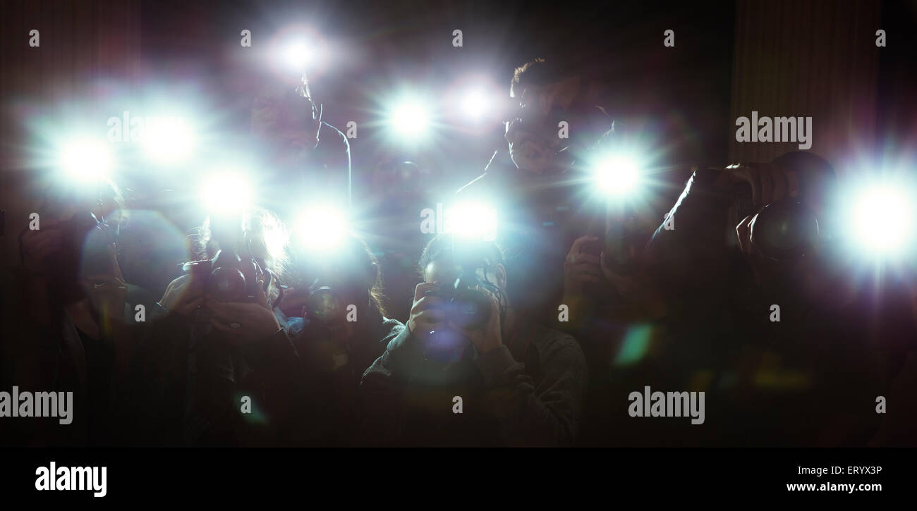 Lente flash di paparazzi fotografi' telecamere Foto Stock