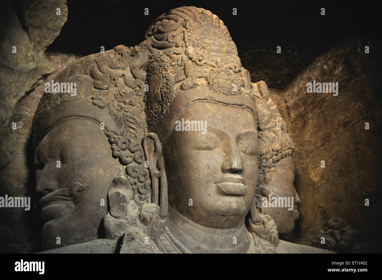 Lord Shiva, Grotte di Elephanta, scultura in pietra, altorilievo, roccia basaltica, Isola di Elephanta, Gharapuri, Bombay, Mumbai, Maharashtra, India, Asia Foto Stock