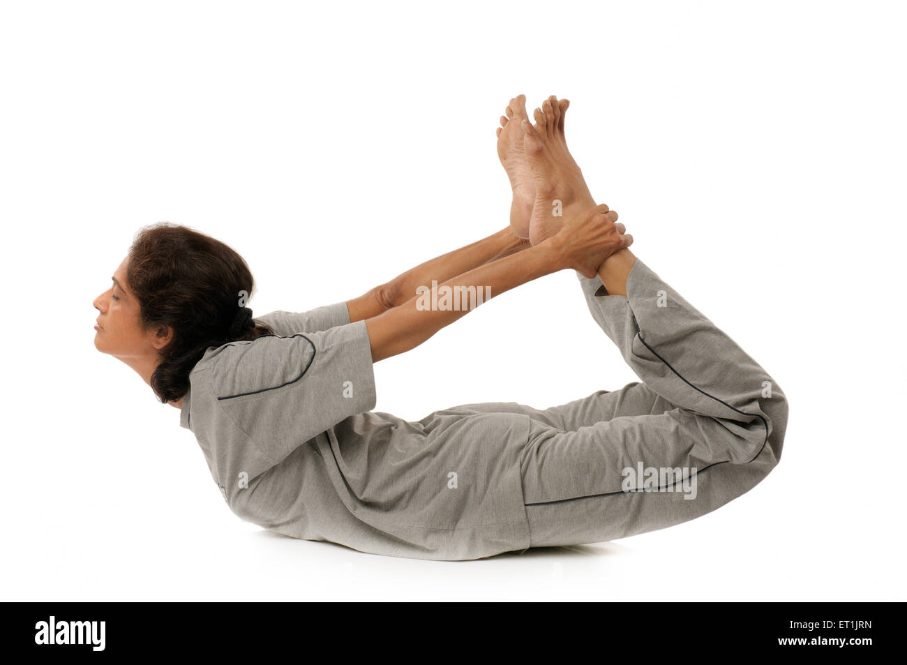 Signora facendo esercizi yogiche dhanura asana signor#190 5 Settembre 2009 Foto Stock