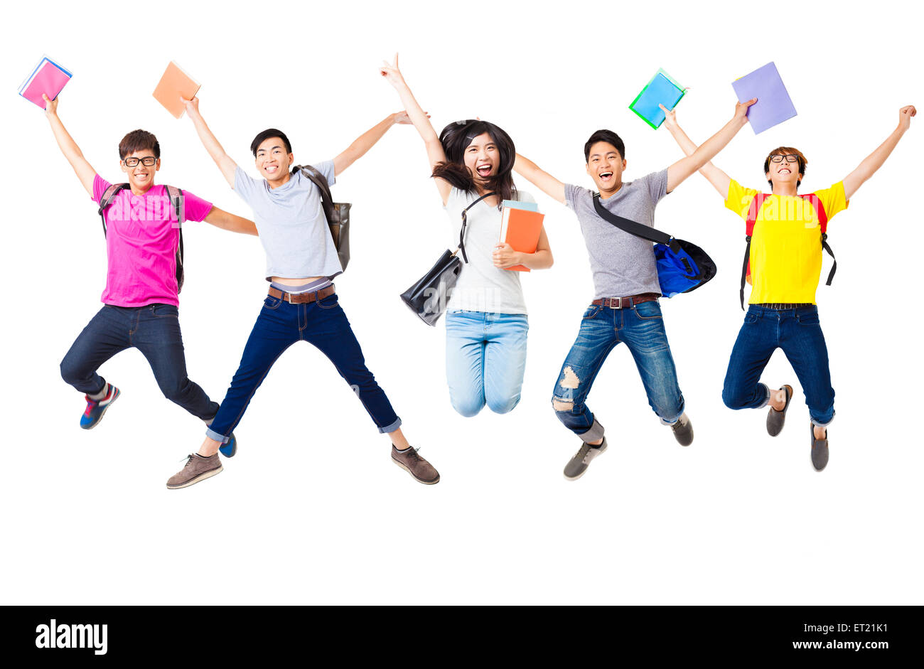 Felice gruppo di studenti jumping insieme Foto Stock