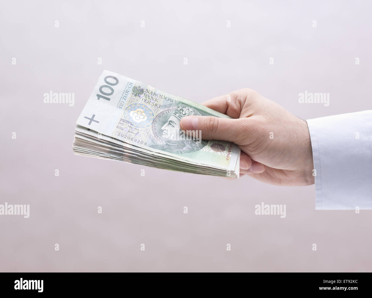 Il polacco soldi in mano Foto Stock