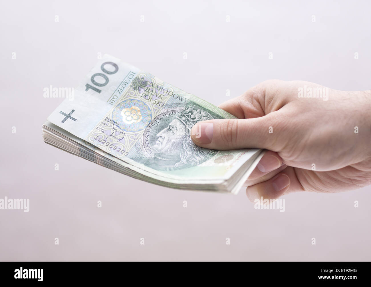 Il polacco soldi in mano Foto Stock