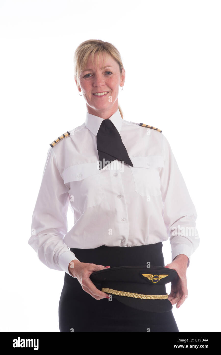 Femmina attraente pilota di linea in piedi in uniforme Foto Stock
