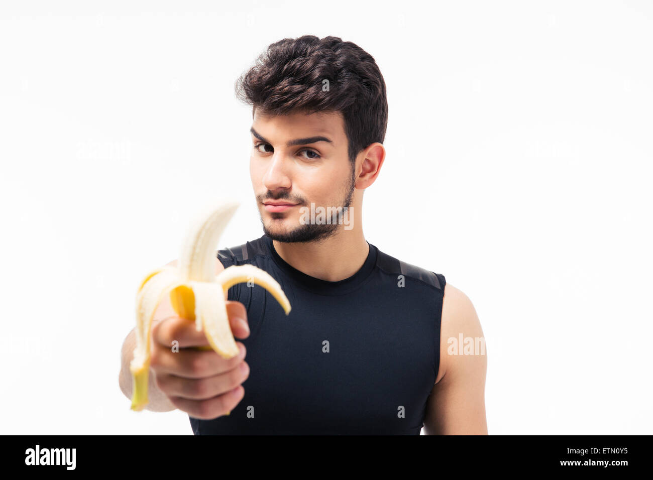 Bel giovane azienda banana isolato su uno sfondo bianco Foto Stock