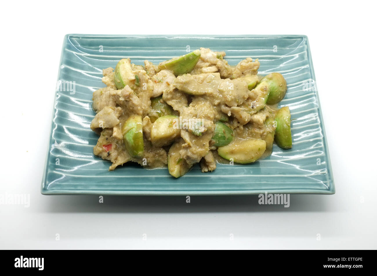 Fried curry verde con carne di maiale e melanzana, cibo tailandese Foto Stock