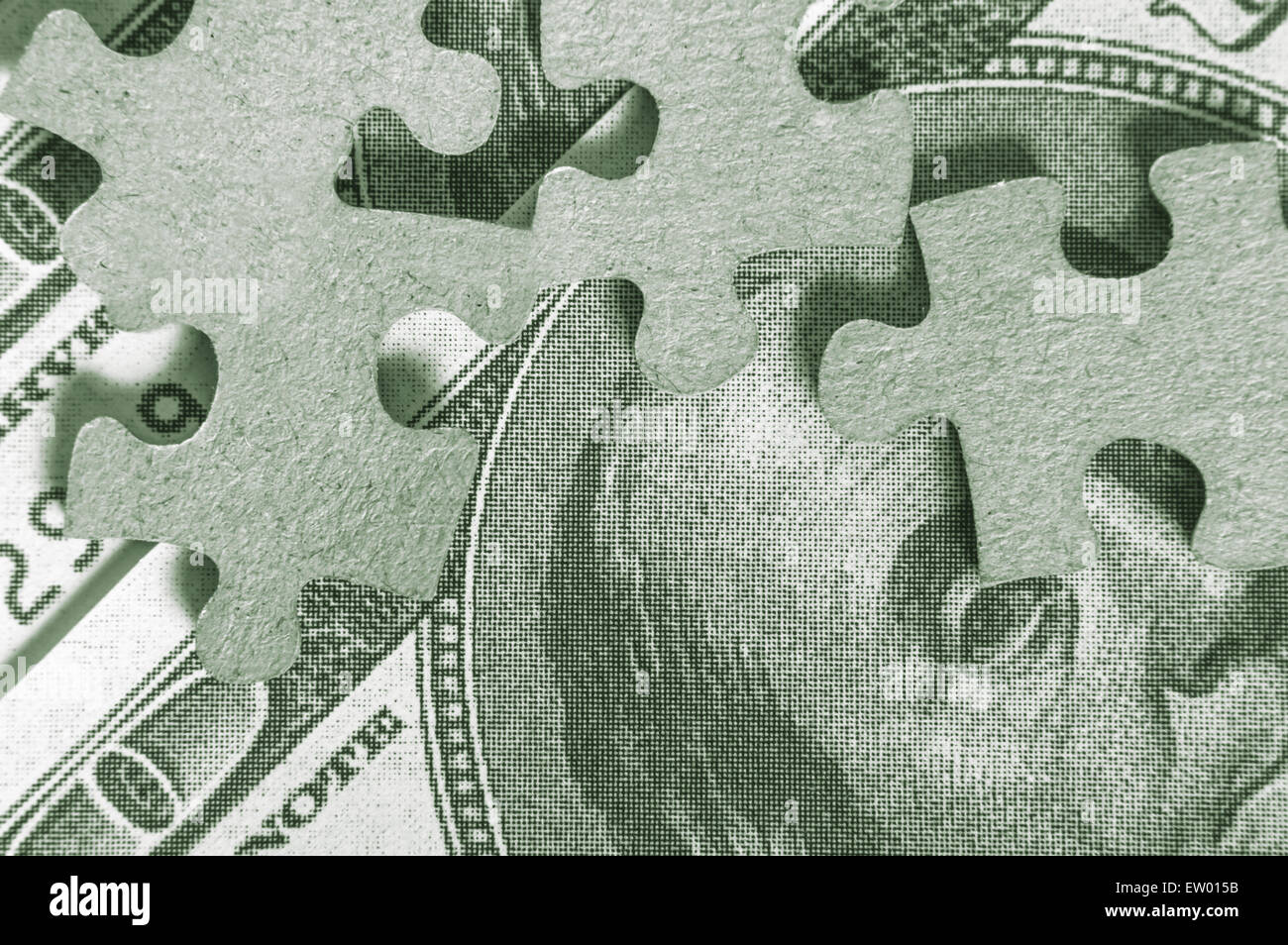 Un puzzle con USA centinaia di fatture del dollaro. Foto Stock