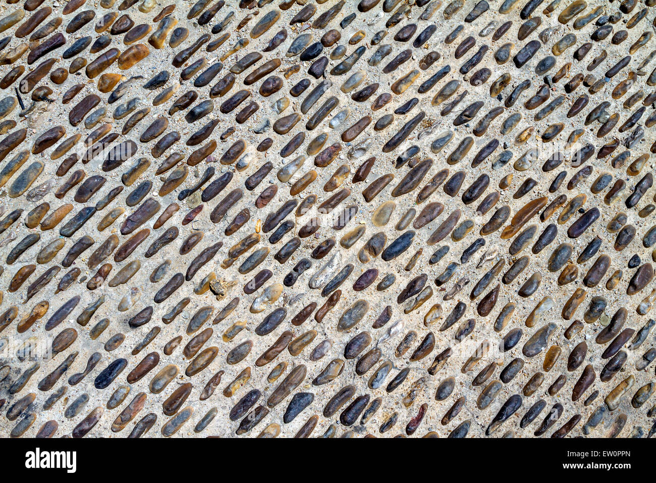 Marrone e ciottoli neri sullo sfondo del pavimento Foto Stock