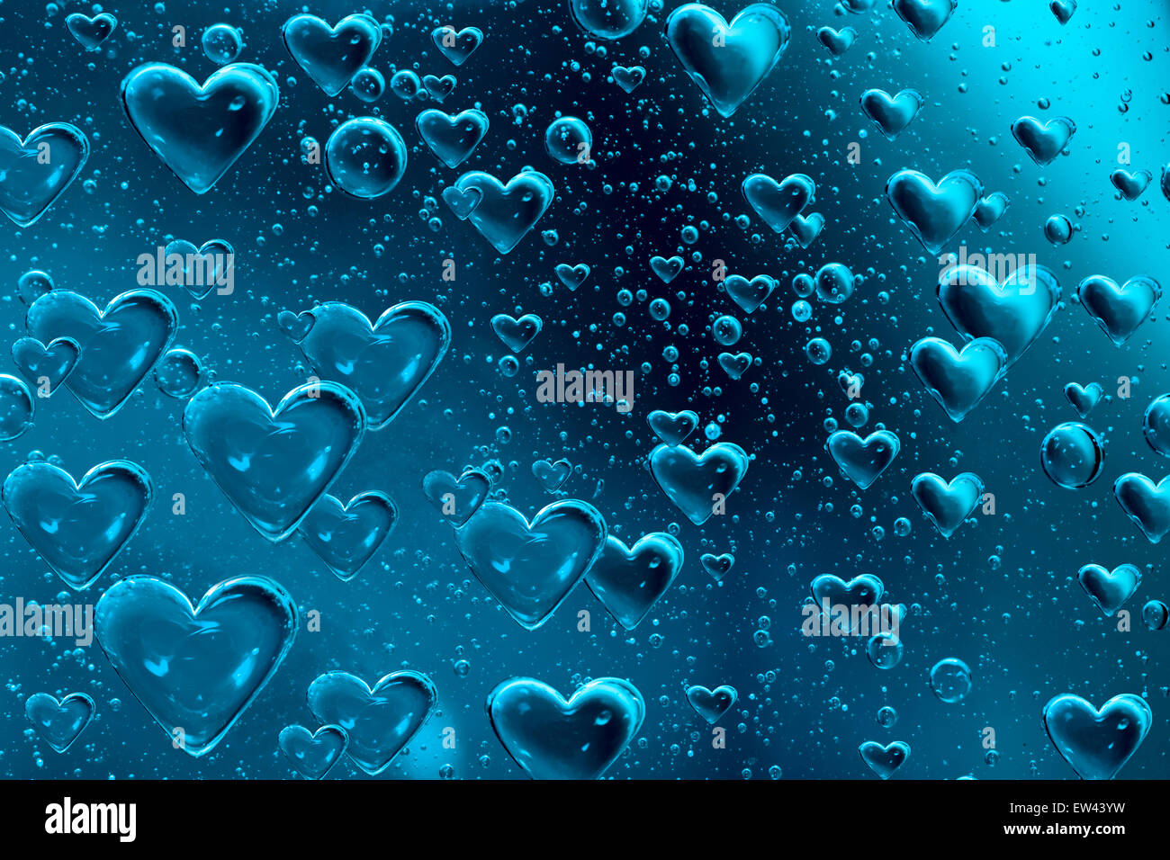 Blu cuore flottante bolle Foto Stock