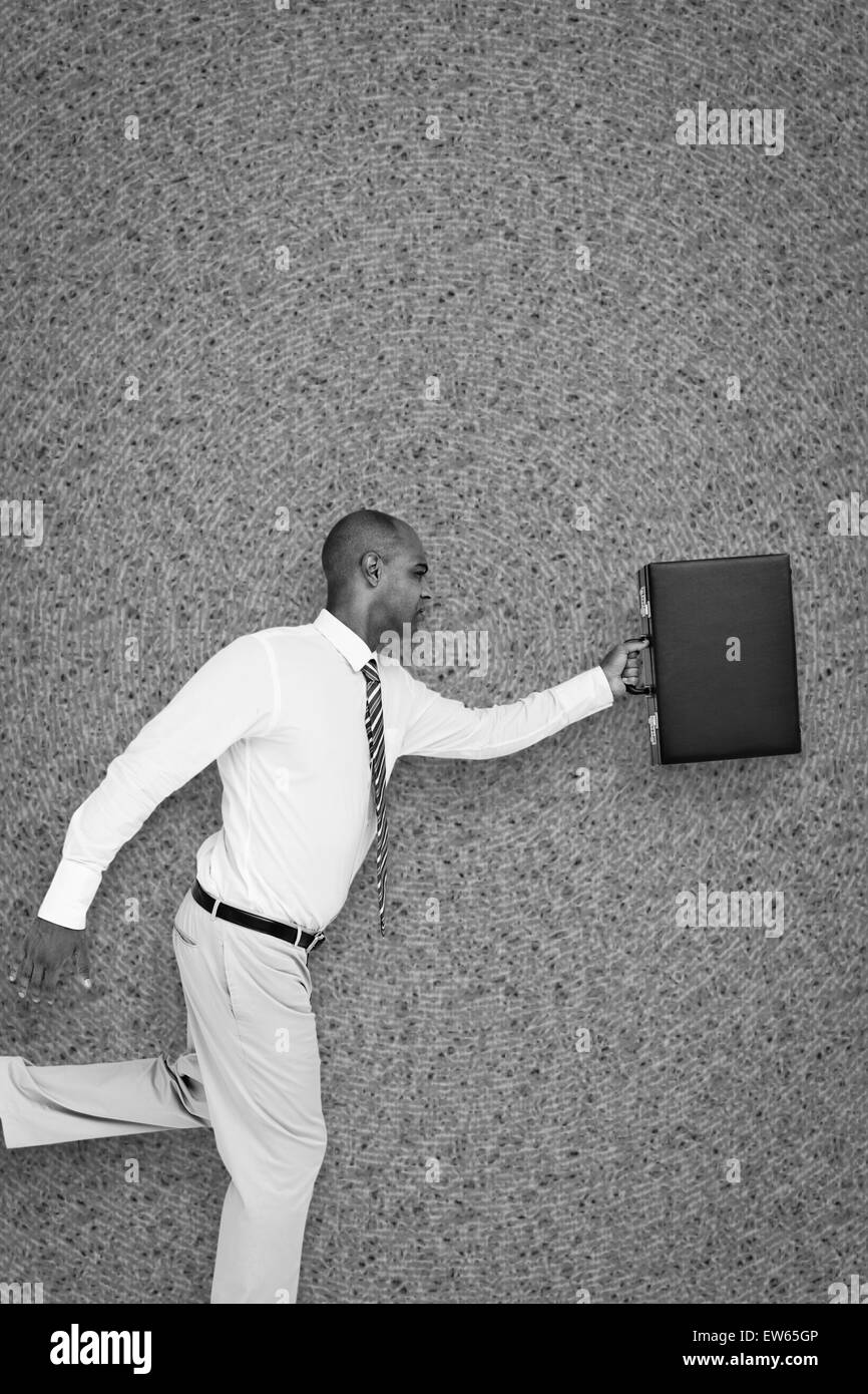 Immagine composita di imprenditore in esecuzione con valigetta Foto Stock